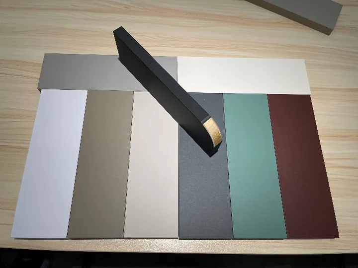 Solid-color decorative panel samples in different colors and surface effects
